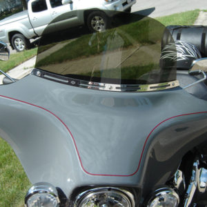 Your windshield rocks! The Freedom Shield knocks the wind down and just flat out, looks great!